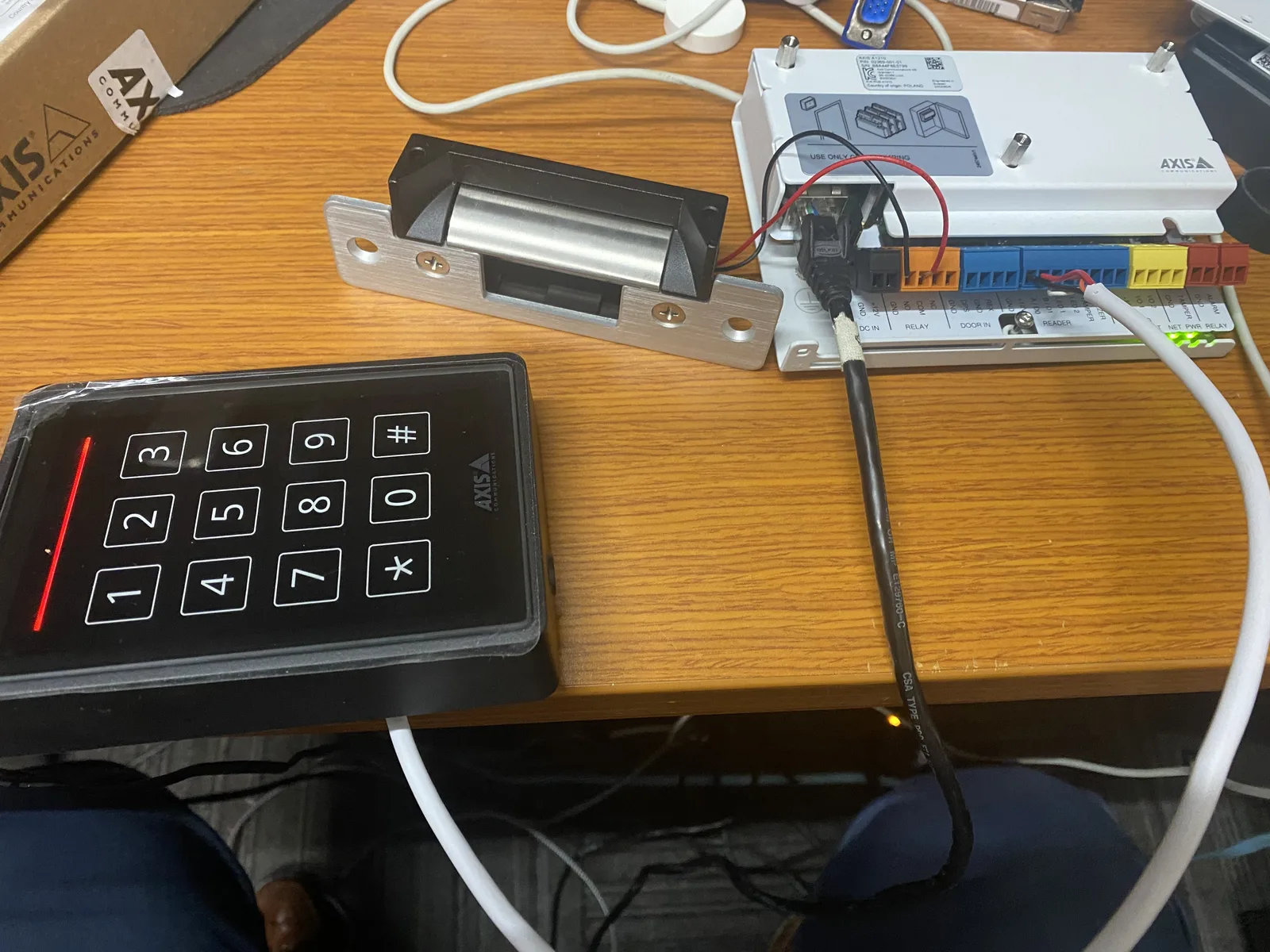 Home 17 AXIS access control keypad and door controller configured by BitNetica for secure building entry