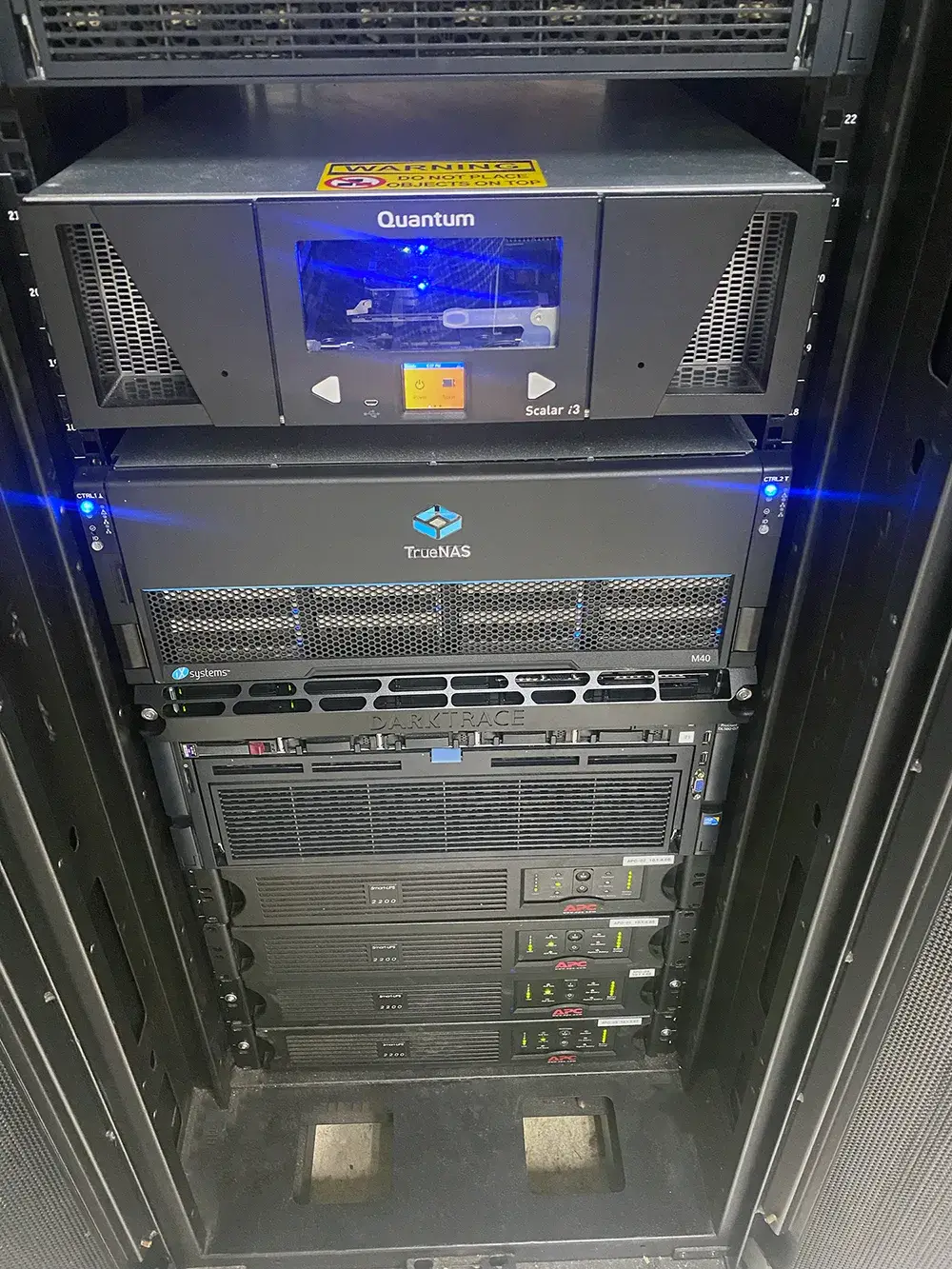 Home 14 BitNetica-managed backup and disaster recovery rack with Quantum tape library, TrueNAS storage, and Darktrace AI threat detection in McHenry County, IL