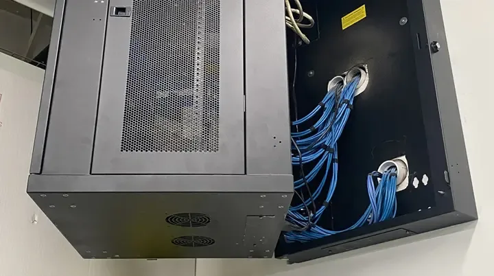 Home 23 Wall-mounted network cabinet with structured cabling installed by BitNetica in a McHenry County office